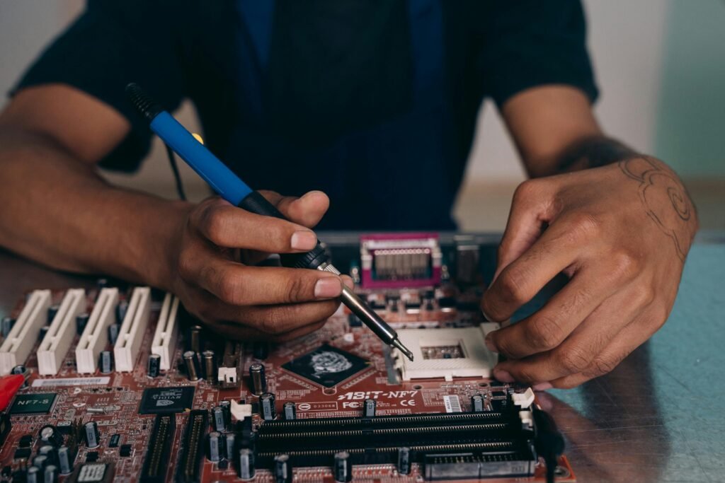 An electrician fixing a motherboard