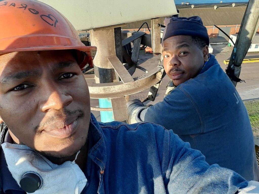 two electricians smiling